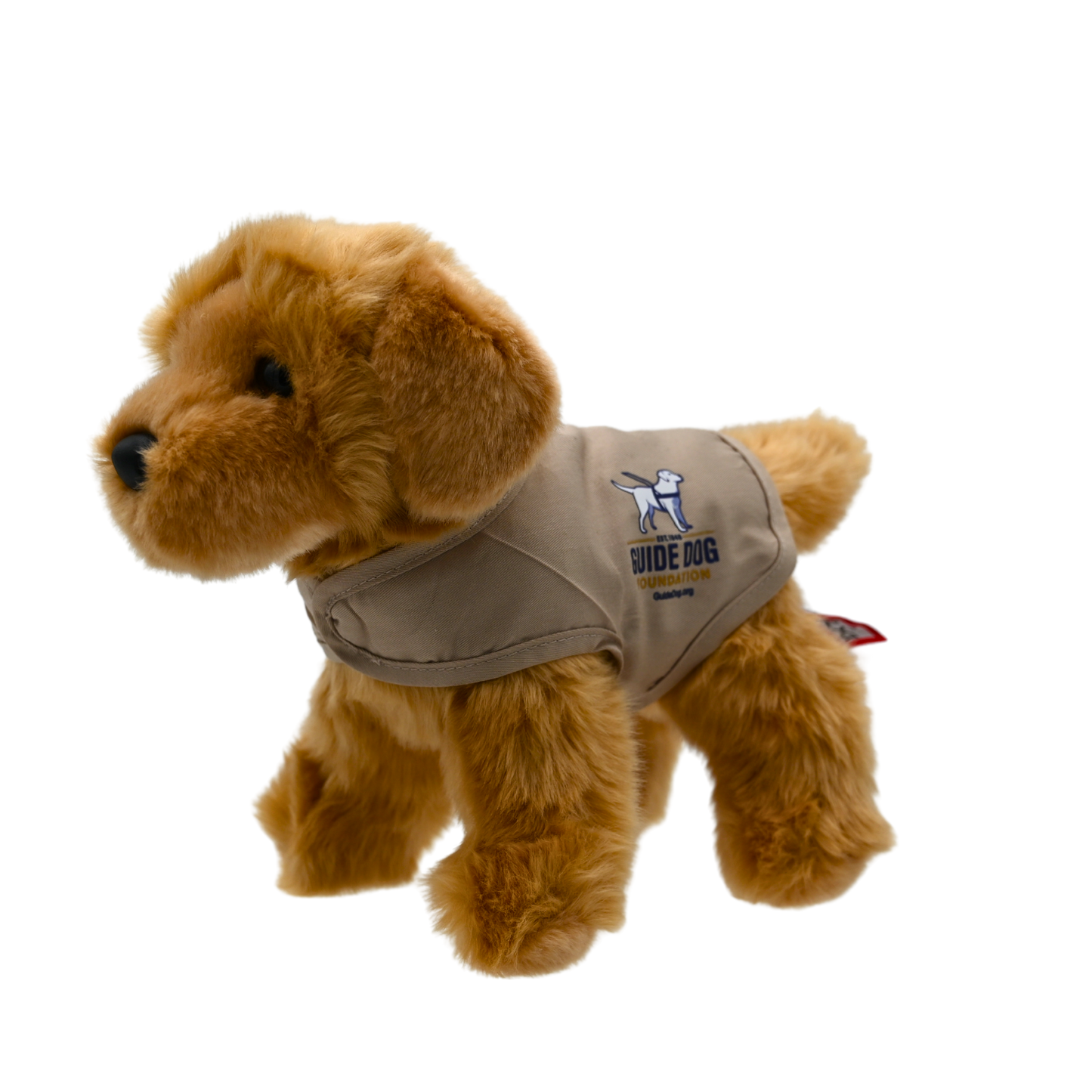 Introducing our 8-inch Golden Retriever Plush Puppy, a charming and lifelike companion captured in the image. Dressed in a tan vest adorned with the logos of America's VetDogs and the Guide Dog Foundation, this adorable plush not only boasts authenticity but also contributes to these noble organizations. With soft golden fur and a friendly expression, it's a heartwarming addition to any collection, combining cuddly charm with a meaningful cause.