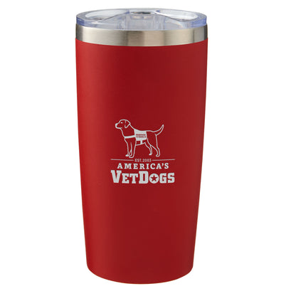 This image features a red 20 oz travel mug with a silver rim at the top and a clear plastic lid. The logo on the mug is for America's VetDogs, established in 2003. The logo includes an outline of a Labrador Retriever-style dog wearing a vest labeled "Service Dog" and standing above the organization's name. The organization's name, "AMERICA'S VETDOGS," is written in bold white letters with a star inside the "O" in "VETDOGS.