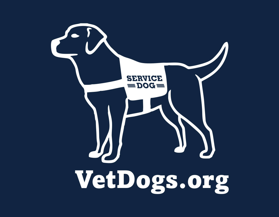 the image shows an up close shot of the service dog cartoon in a vest that is located on the back neck of the sweatshirt. Below the image is the text, "VetDogs.org" the image and text is in white