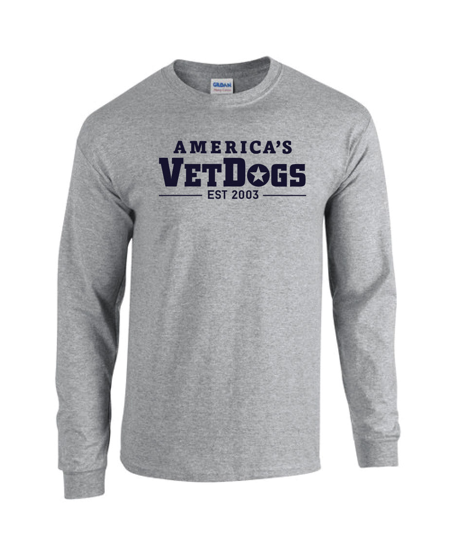 Front facing photo of a long sleeved shirt that is grey in color. The shirt has fitted wrists. The front of the shirt says "America's VetDogs EST. 2003" in navy blue colored letters