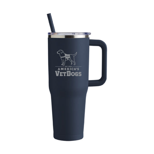 Sleek navy blue 20oz tumbler with stainless steel cut out of America's VetDogs logo on the front. A navy blue straw and clear lid.