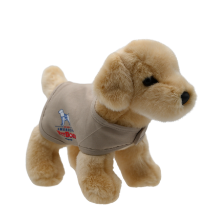 This 8-inch Yellow Labrador Plush Puppy, captured in the image, exudes charm with its lifelike features and soft golden fur. Wearing a tan vest proudly displaying the logos of America's VetDogs and the Guide Dog Foundation on either side, this adorable plush not only looks authentic but also supports these noble organizations. Its friendly expression and meticulous detailing make it a heartwarming addition to any collection.